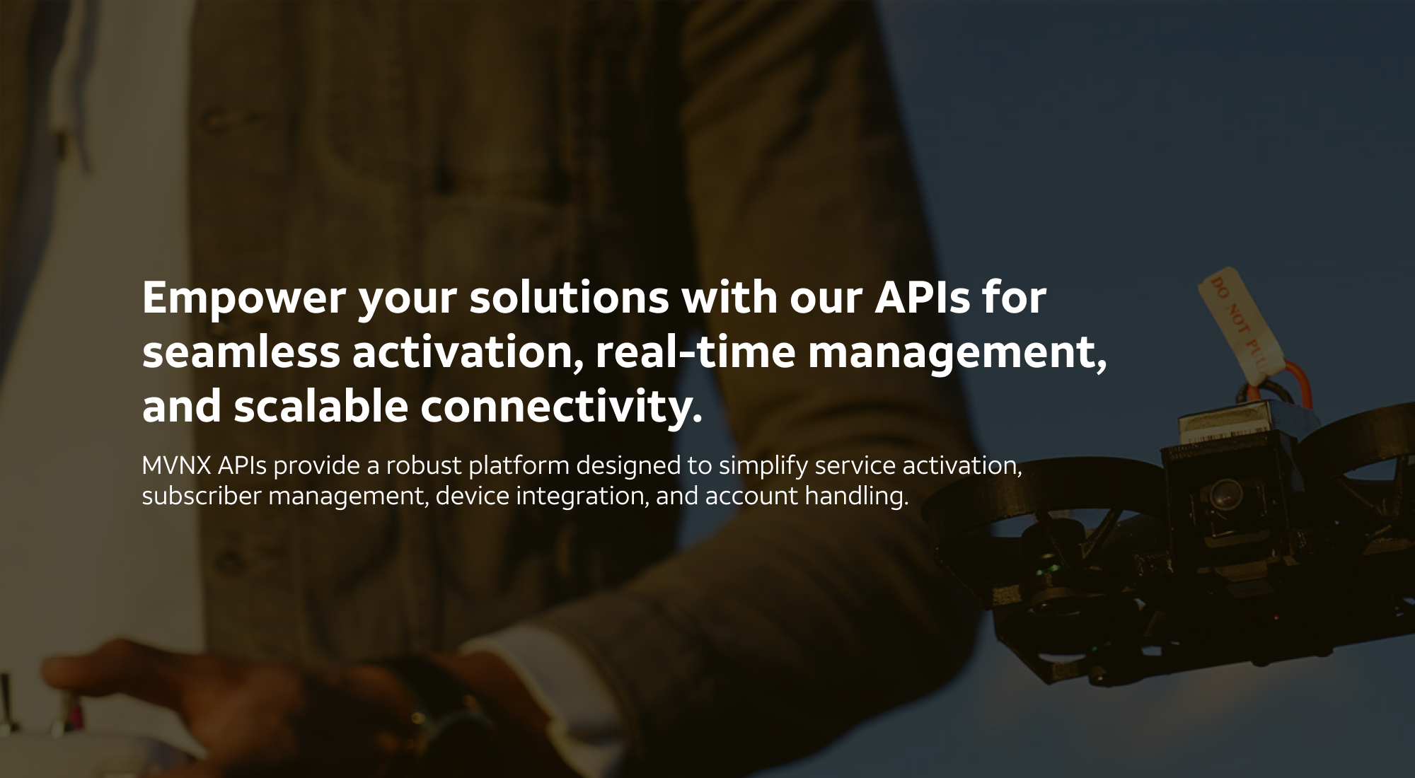 MVNX Solutions hero - Man piloting a drone, overlaid with text that says "Empower your solutions with our APIs for seamless activation, real-time management, and scalable connectivity.
